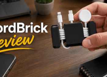 CordBrick weighted cord holder organizing cables on a wooden desk