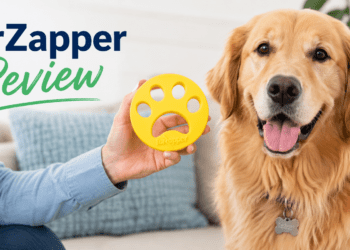 Woman holding yellow FurZapper pet hair remover next to golden retriever