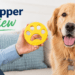 Woman holding yellow FurZapper pet hair remover next to golden retriever