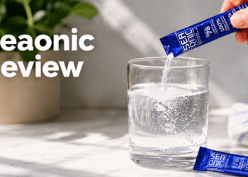 A person pouring a Seaonic liquid marine plasma sachet into a glass of water for pure hydration