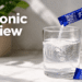 A person pouring a Seaonic liquid marine plasma sachet into a glass of water for pure hydration