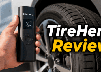 Person holding TireHero portable air compressor next to a car tire.