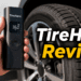 Tirehero Review: Is This Smart Portable Inflator Actually Worth It? 7 Person holding TireHero portable air compressor next to a car tire.